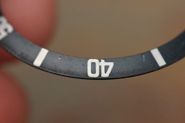 Alternative view of 1960's Rolex MK1 "Kissing 4" Bezel Insert for gilt Subs